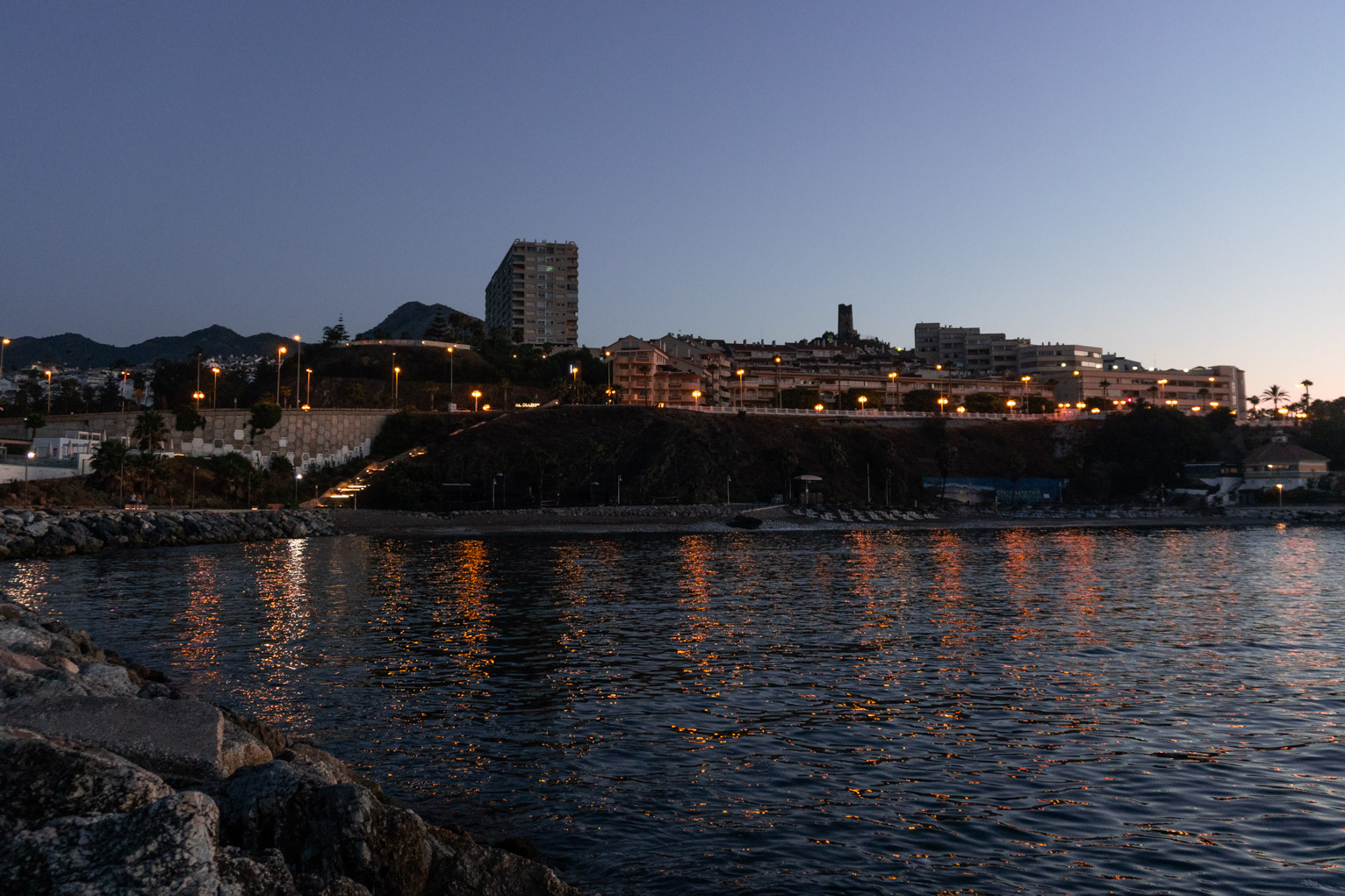 Lights reflect all pretty on the shore